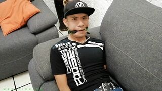 18-Year-Old Cutie Gets Tickled All Over His Super Ticklish Body. Especially His Soft Feet Are Very Ticklish. To Punish The Boy Even More He Also Gets Gagged & Blindfolded. Watch Him Squirm!