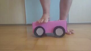 Crushing a tiny woman and her car (toys)