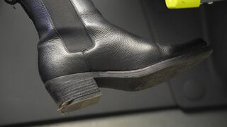 Bratty woman with dirty riding boot close-up. Boot fetish admiration and inspection.
