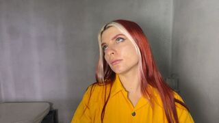 Audrey behind bars in handcuffs and shackles