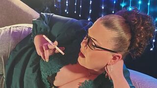 On my side in a new green blouse smoking a VS 120 closer up