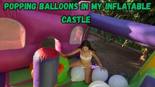 Popping balloons in my inflatable castle