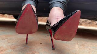 Lucrecia, wearing stiletto heels, the old car won't start, she floors the accelerator and wiggles her breasts.