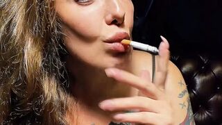 Smoking in shorts and a sports bra, no makeup – Newport Menthol