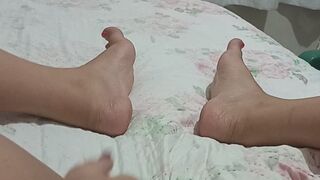 Beautiful brunette shows her pussy and feet.