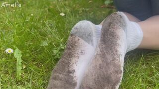 Amelie gets her Hanes white socks dirty while gardening