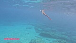 Carissa mermaiding in the Red Harlot tail in the Pacific Ocean