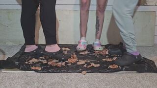 3 women smashing sausages in crocs