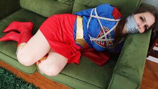 Mina Salome is Supergirl her secret identity has been exposed and she is humiliated all tied up and wraparound tape gagged