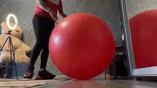 girl in sneakers jump on big re yoga ball