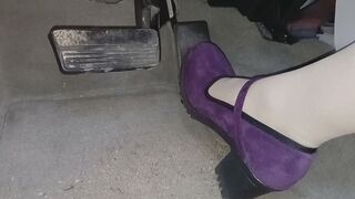 Evalynn driving in purple heels