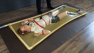 Disciplined punishment and spanking of a naughty adult student in a latex vacuum bed