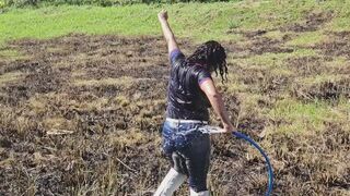 Outdoor hose wetlook wearing navy polo shirt and jeans
