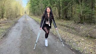 Walking on crutches, leg in a cast, broken foot