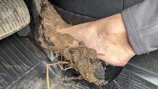 With wheels spinning in the mud, she pumped the pedals and revved the engine, but the car remained stuck. Her high heels were ruined and muddy. The situation seemed hopeless.