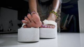 White pumps and purple nails