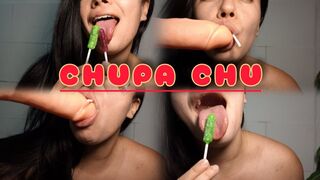Sucking on a lollipop and a dildo at the same time