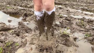 White knee socks in deep mud, muddy feet, muddy socks