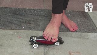 Model Car under naked feet