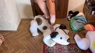 a girl in lingerie with bare feet brutally tramples an inflatable dog and a zebra, steps on them, tramples them, walks, crushes, jumps, sits on them, sits on their face foot fetish crash fetish dominance legs