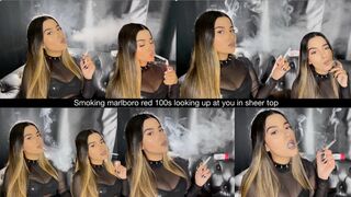 Smoking marlboro red 100s looking up at you in sheer top