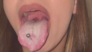 Long pierced tongue covered in thick white coat in the morning