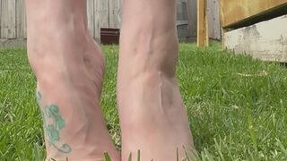 Veiny Barefoot Tease in the grass