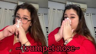 Blowing his nose like a trumpet + close-up
