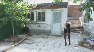 ly34-The girl was walking outdoors with her feet shackled.