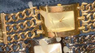 POV cumshot on the face of both a silver and gold Guess heavy metal watch!