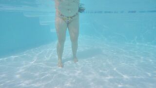 SFW - Beautiful teen swimming underwater