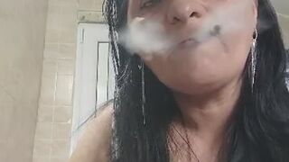 Smoking Mature Woman in Plaid Dress – Close-Up.