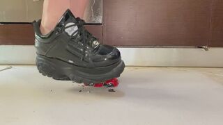 Boy with Buffalo black patent platform sneakers crush stomp smash and destroy damaged toys cars model