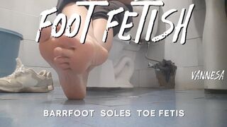 In the office bathroom rubbing their feet against each other (7)